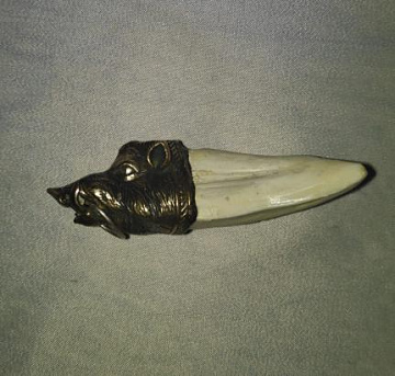 Фото Клык кабана с головой из металла